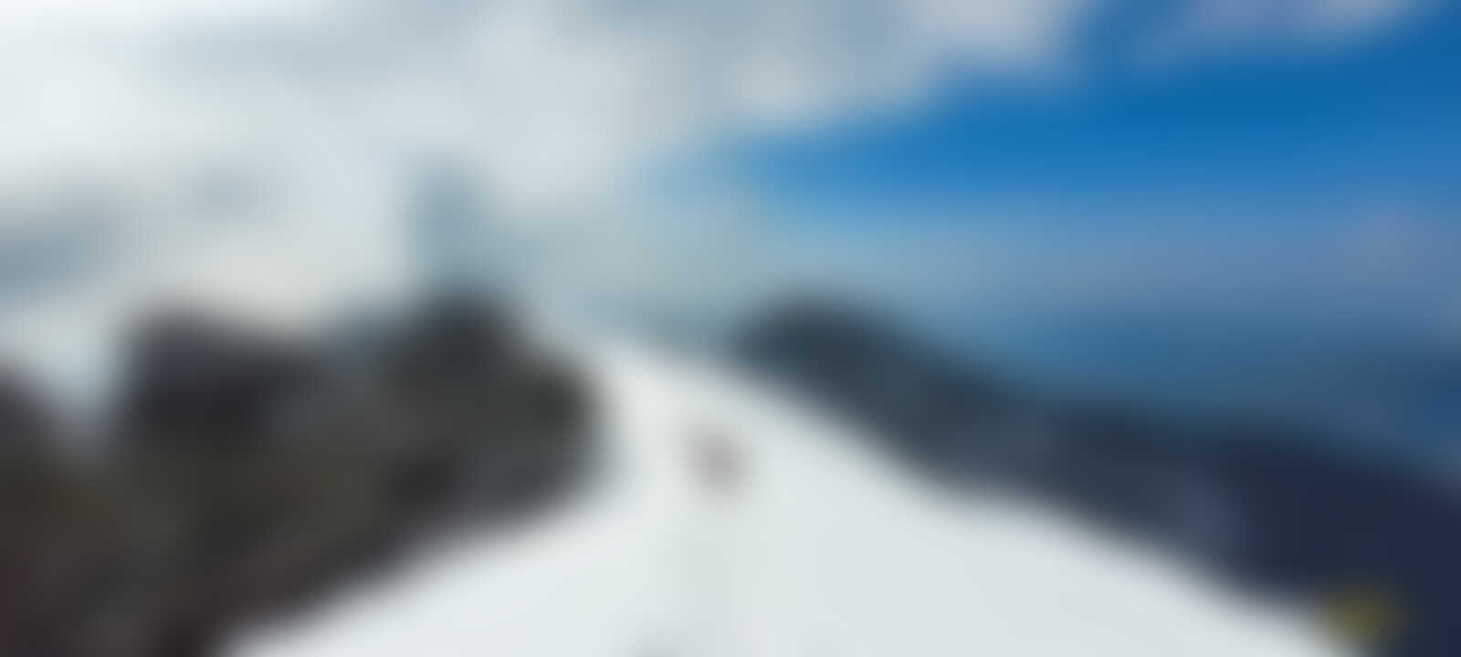 low-preview-A group of trekkers traversing through ankle deep snow on a ridge in the months of February and Early March